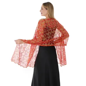 Detailed back view of an elegant red lace shawl featuring gold sequin phoenix embroidery