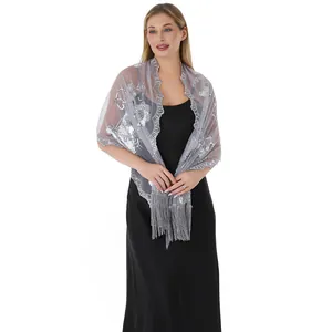 Elegant silver sequined embroidered mesh shawl with grey tassels shown on a model