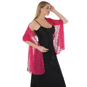 Elegant magenta lace shawl with sequin floral embroidery over a black evening dress