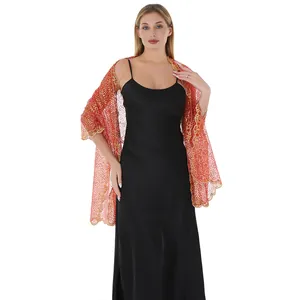 Detailed view of elegant red sequined embroidered shawl paired with a black silk dress