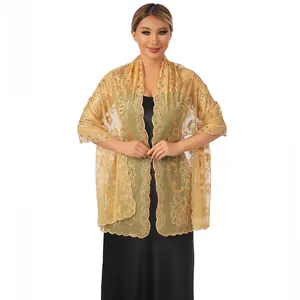 Detail view of elegant gold sequin lotus embroidery on formal evening lace shawl
