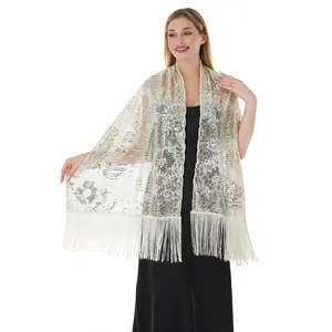 Detail of sparkling sequin floral shawl with elegant fringe for evening dresses