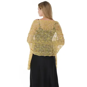Detail back view of elegant gold sequined embroidered bridal shawl on black dress