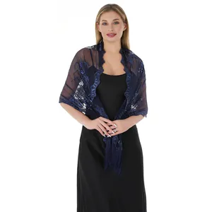 Detail view of navy blue sequin embroidered shawl with tassel trim for evening wear