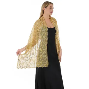 Detailed view of elegant gold sequined phoenix tail embroidery on wedding shawl.