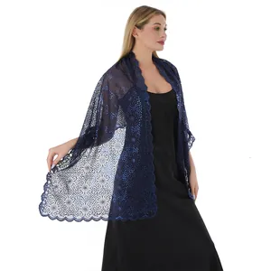 Detail of elegant navy blue lace shawl with floral sequin embroidery for evening dresses