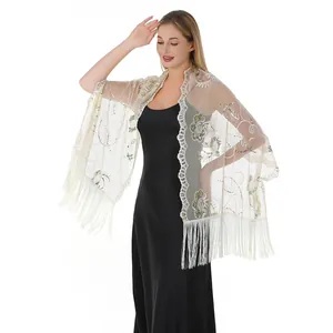 Detailed view of elegant beige sequined embroidered shawl with fringe for evening wear.