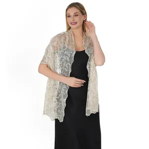 Elegant detail view of champagne sequin embroidered shawl with phoenix tail lace