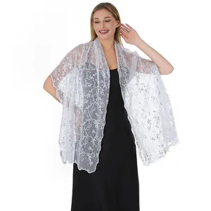 Close-up of elegant silver sequin embroidered floral mesh shawl for wedding and evening gowns
