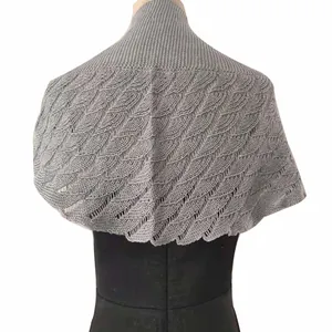 Detailed back view showing the intricate fishtail knit pattern of this grey shawl