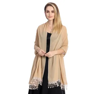 Elegant champagne beige chiffon shawl wrap with intricate lace tassels on model