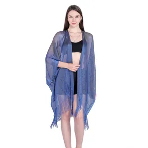 Detail of a blue sheer metallic shawl with elegant fringe tassels on white background