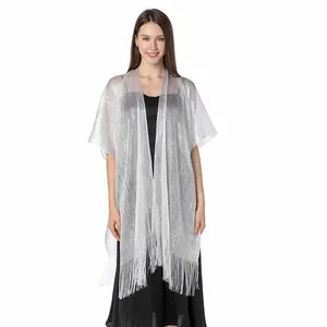 Elegant sparkling silver metallic fringe shawl draped over a black evening dress
