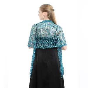 Back view of a blue sequined shawl with fringe, perfect for evening gowns.