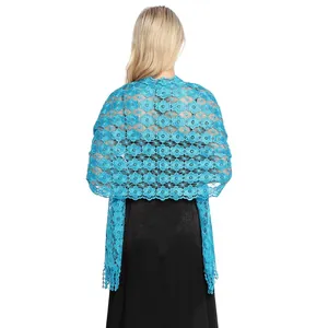 Detailed view of bright blue floral lace shawl with delicate embroidered flower patterns