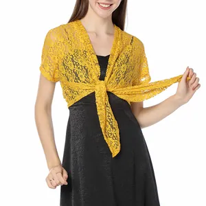Macro detail showing yellow floral lace shrug cardigan with elegant front tie-up closure