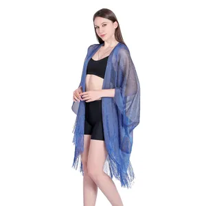 Elegant shimmering blue shawl with fringes and armholes as beach cover-up