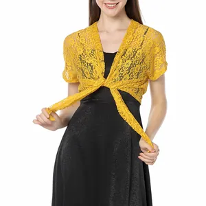 Detail shot of a yellow floral lace shrug with a front tie closure for women.
