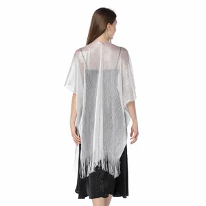 Back view of silver shimmering metallic thread shawl featuring elegant fringe detail.