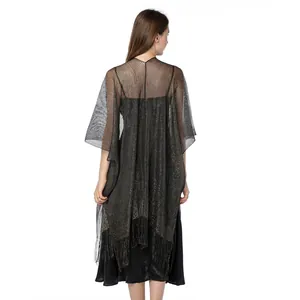 Back view of sparkly metallic gold shawl with elegant fringe trim for evening wear