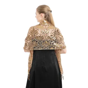 Rear view of an elegant gold sequin tassel shawl paired with a formal black party dress.