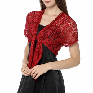 Close-up detail showing the intricate floral lace pattern of the red tie-front shrug