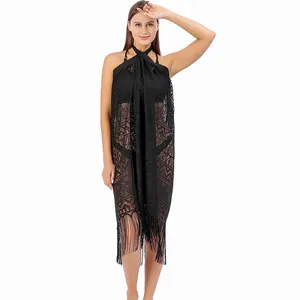 Detailed view of black lace beach sarong with fringe and geometric patterns
