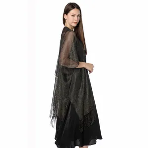 Side view of elegant sparkling metallic shawl with long fringe for evening gowns