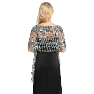 Rear view detail of an elegant silver sequin fringe shawl worn over a black dress