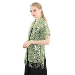 Elegant green sequin shawl with tassels on a female model