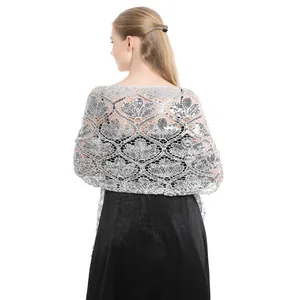 Rear view detail of an elegant silver sequined shawl paired with a black evening dress.