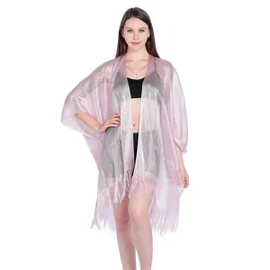 Detail of shimmering pink metallic shawl with fringe, perfect for beach cover-up.