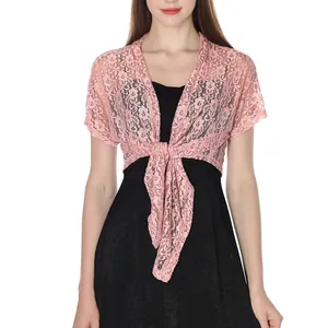 Close-up of pink floral lace texture and tie-front closure on a short-sleeved shrug