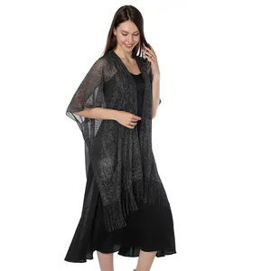 Elegant metallic glitter shawl with fringe detail on a female model