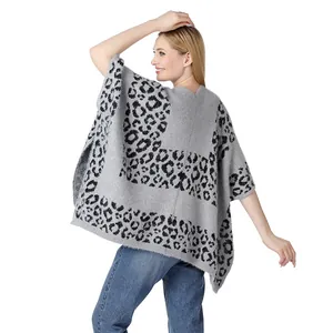 Back view of a stylish grey and black leopard print knit poncho with a side split design