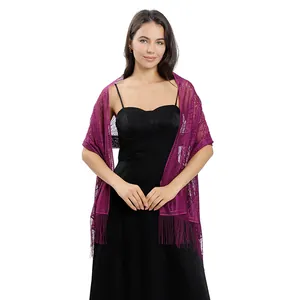 Elegant purple lace evening shawl with fringe worn over a classic black formal dress.