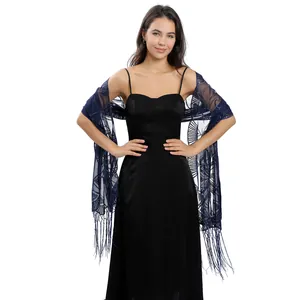 Detailed view of the navy blue sequin shawl featuring floral embroidery and tassels
