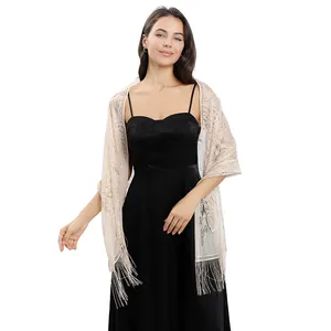 Elegant beige lace shawl wrap with fringe tassels styled on a black evening gown.