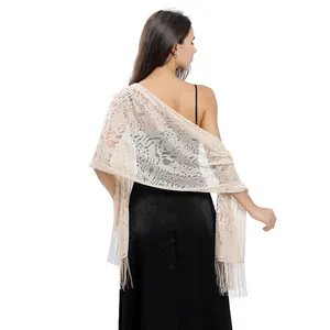 Back view of elegant beige floral lace shawl with tassels for formal evening gowns