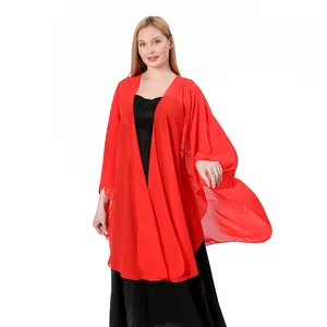 Close-up detail of a bright red chiffon shawl wrap worn for weddings and parties.