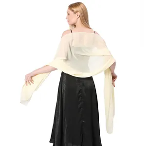 Elegant back view of a sheer cream chiffon evening shawl paired with a black dress