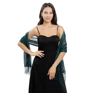 Detailed view of dark green lace shawl scarf on model with black evening dress.