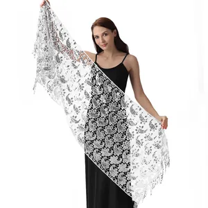 Detail view of silver sequin lace shawl with elegant paisley pattern and fringe