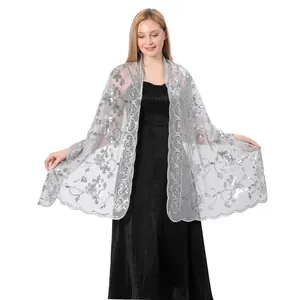Elegant silver sequin shawl wrap for bridal wedding and evening gowns worn by a model.