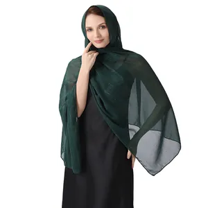 Elegant dark green chiffon shawl with silver silk and rhinestones shown on a model