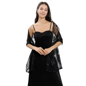 Detailed look of black peony embroidered shawl with sequins on evening dress