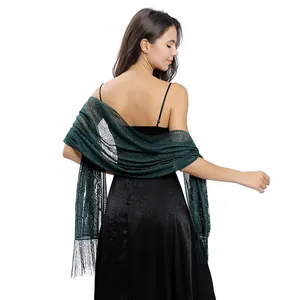 Elegant dark green lace evening shawl with delicate fringe details shown from the back.