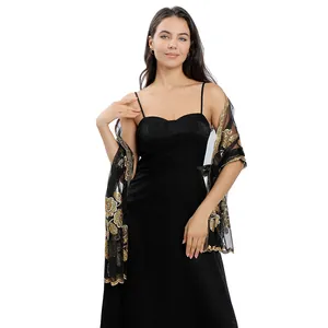 Detail of black mesh shawl with gold sequin peony embroidery for evening dresses