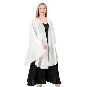 Model wearing a sheer white chiffon bridal shawl wrap over a black evening dress