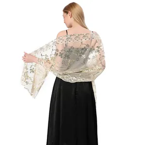 Detailed back view of an elegant gold sequin lace shawl with intricate floral patterns
